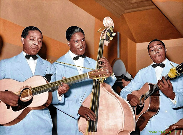 L O N N I E   J O H N S O N Trio (Lonnie Johnson, left, with prob. Andrew Harris on string bass & Dan Dixon on rhythm guitar), April 1941; source: http://www.shorpy.com/node/6852; photographer: Russell Lee (tinted, source: 