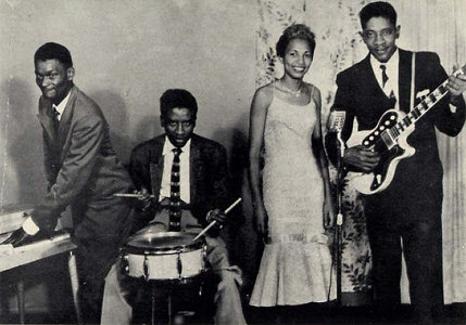 Jo Jo Williams' Blues Band c. 1955 in Chicago, IL; left to right: Lazy Bill Lucas, Johnny Swanns, 'Miss Hi-Fi', Jo Jo Williams (holding a National Glenwood guitar); source: Back cover of Philo 1007 ('courtesy Jo Jo Williams'); click to enlarge!